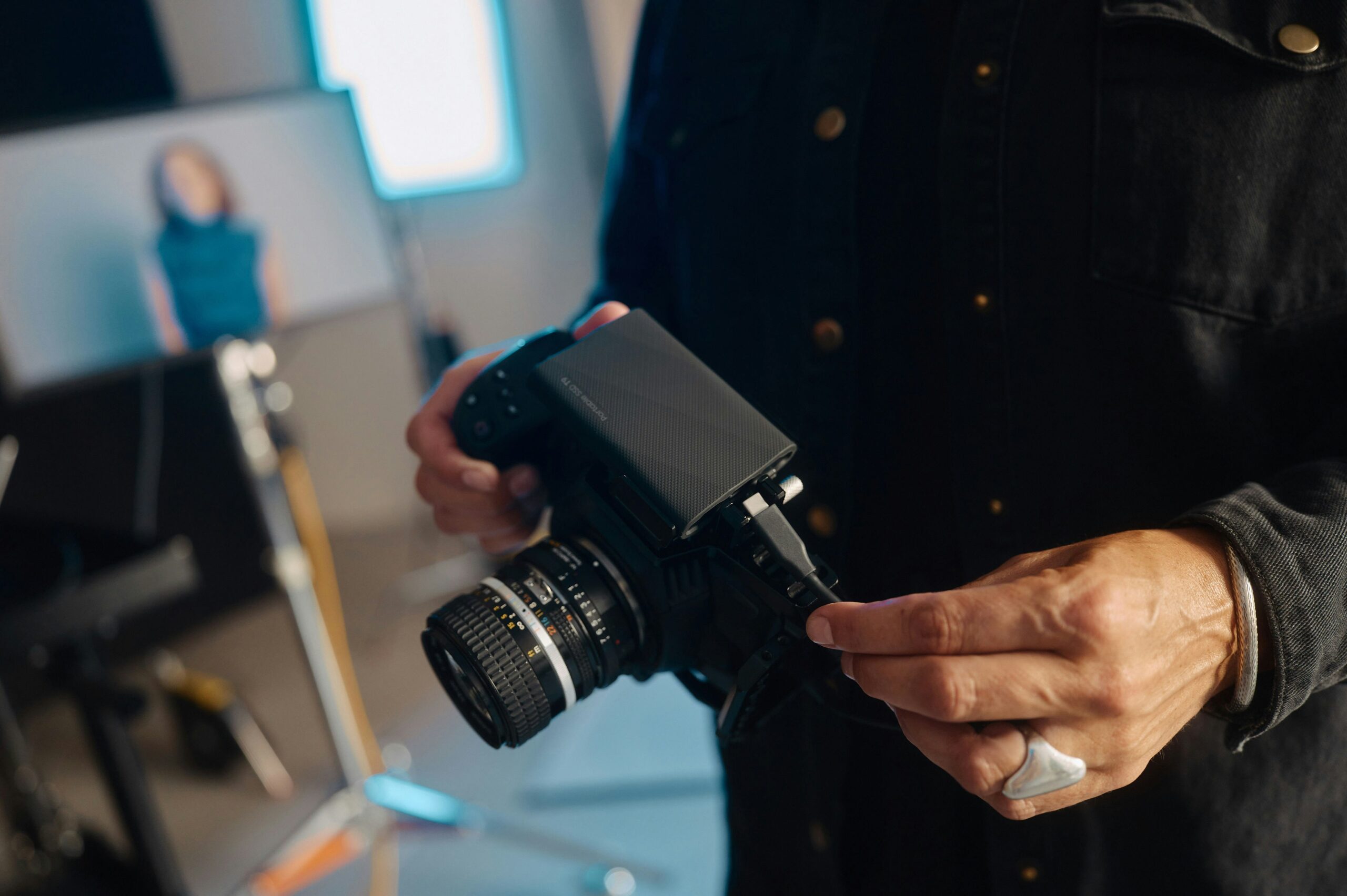 A man holding a camera in his handsFuture Trends in AI for Public Sector Digital Transformation